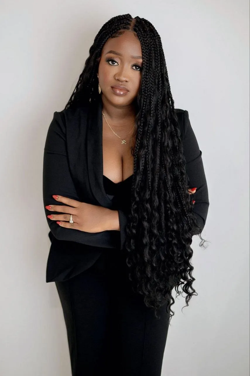 Mariama in her salon blazer — the woman behind the chair